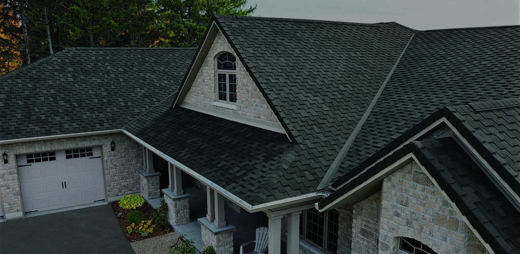 Calgary residential home with asphalt shingle roof installed by professional roofing contractors